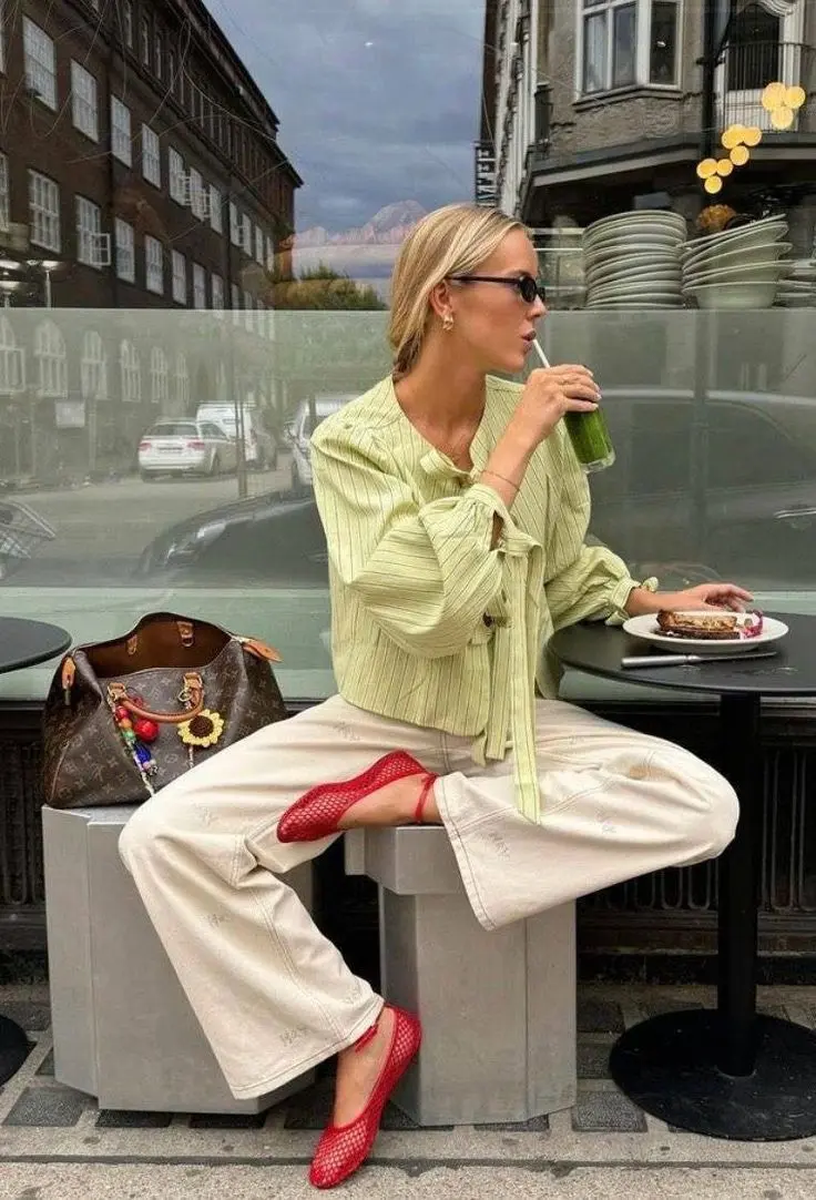 Colorful minimalist spring outfit with chartreuse cardigan and neutral pants