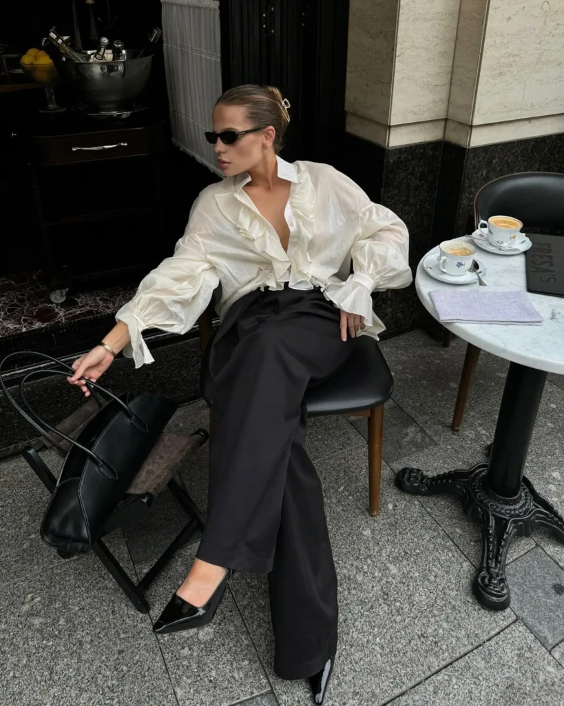 Statement sleeve spring minimalist outfit idea with ruffled blouse