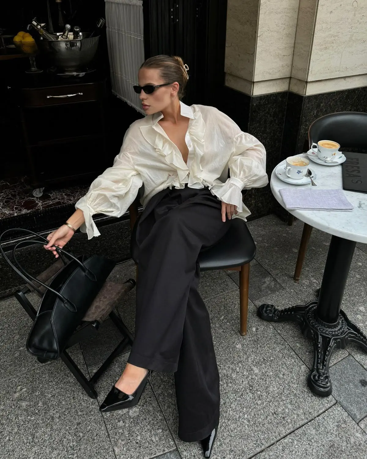 Statement sleeve spring minimalist outfit idea with ruffled blouse