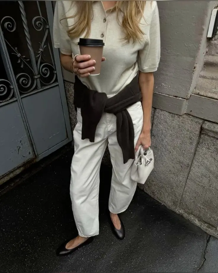 Spring minimalist outfit idea with sweater tied around waist