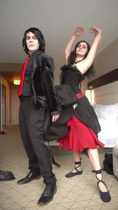 Couple in black and red formal dance costumes posed as tango dancers costume 18