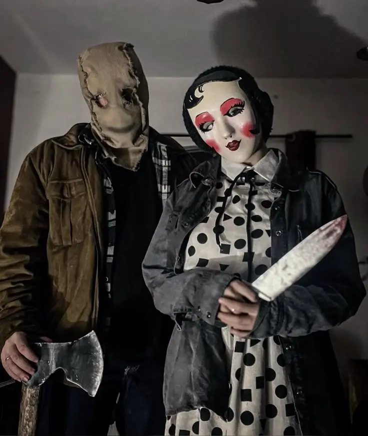 Couple in weathered clothing with burlap and doll face masks as horror movie slashers costume 15