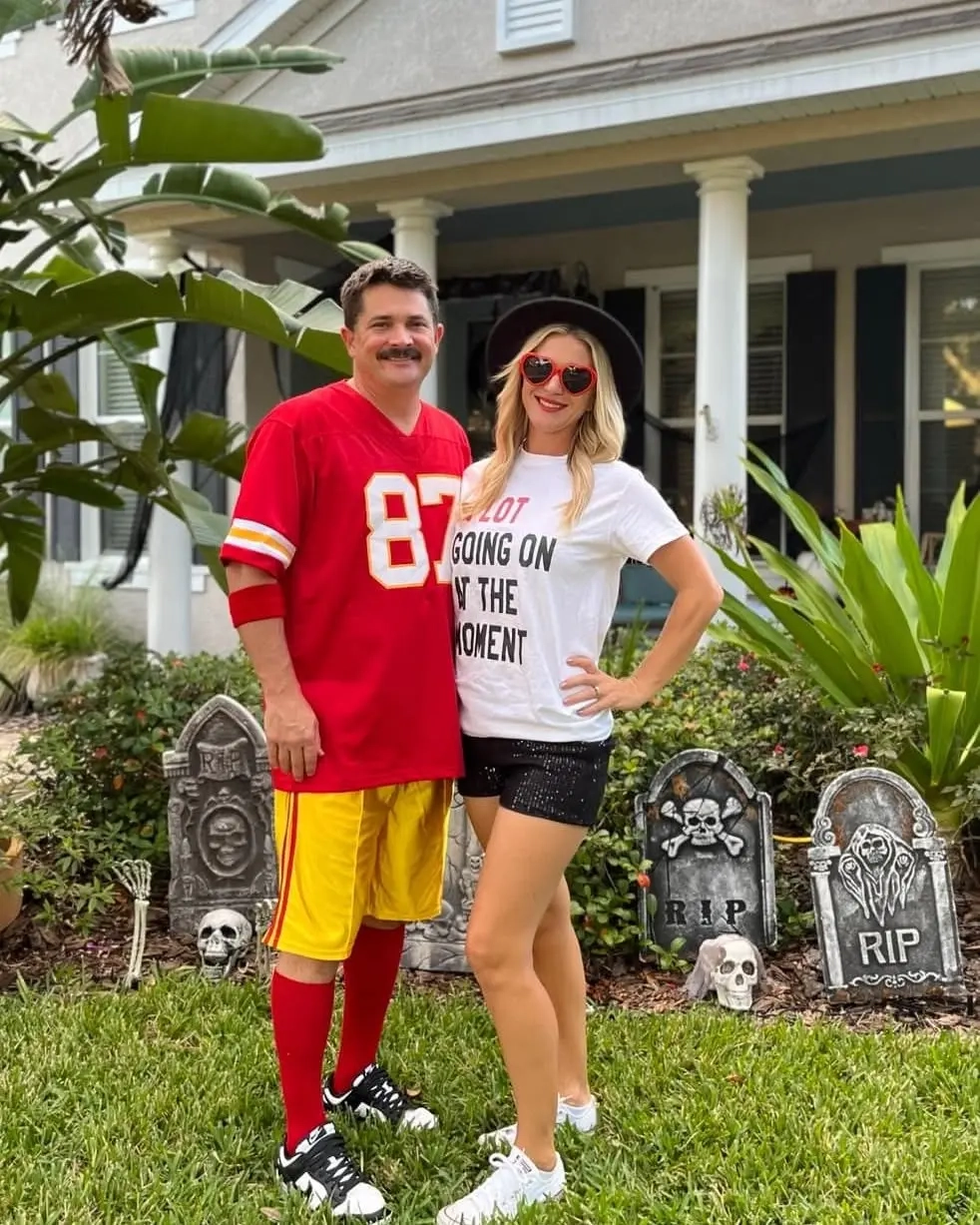 Man in red sports jersey and woman in white shirt with black hat as Travis Kelce and Taylor Swift costume 11