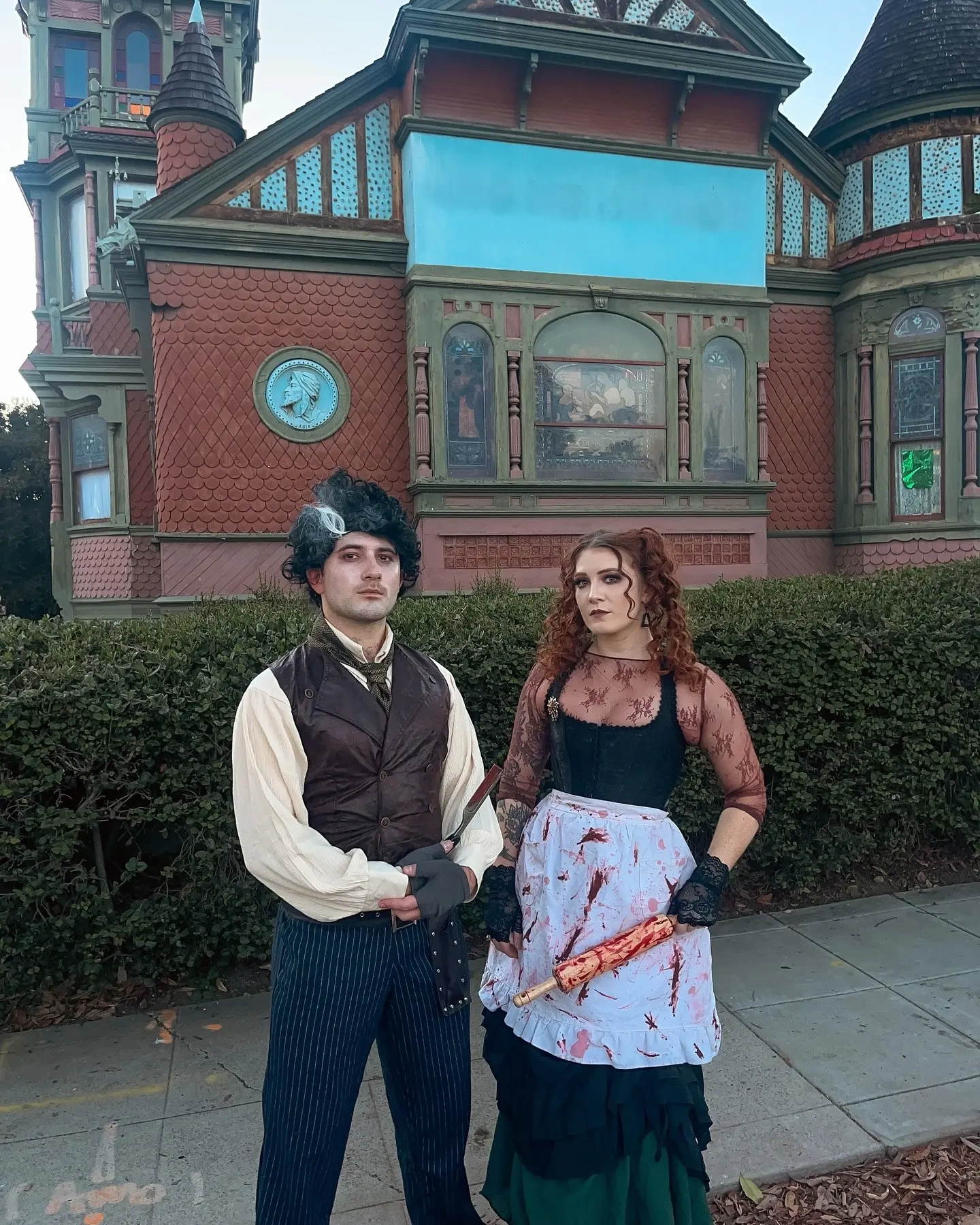 Man in white shirt and pinstripe trousers, woman in corset and skirt as Victorian Sweeney Todd characters costume 12
