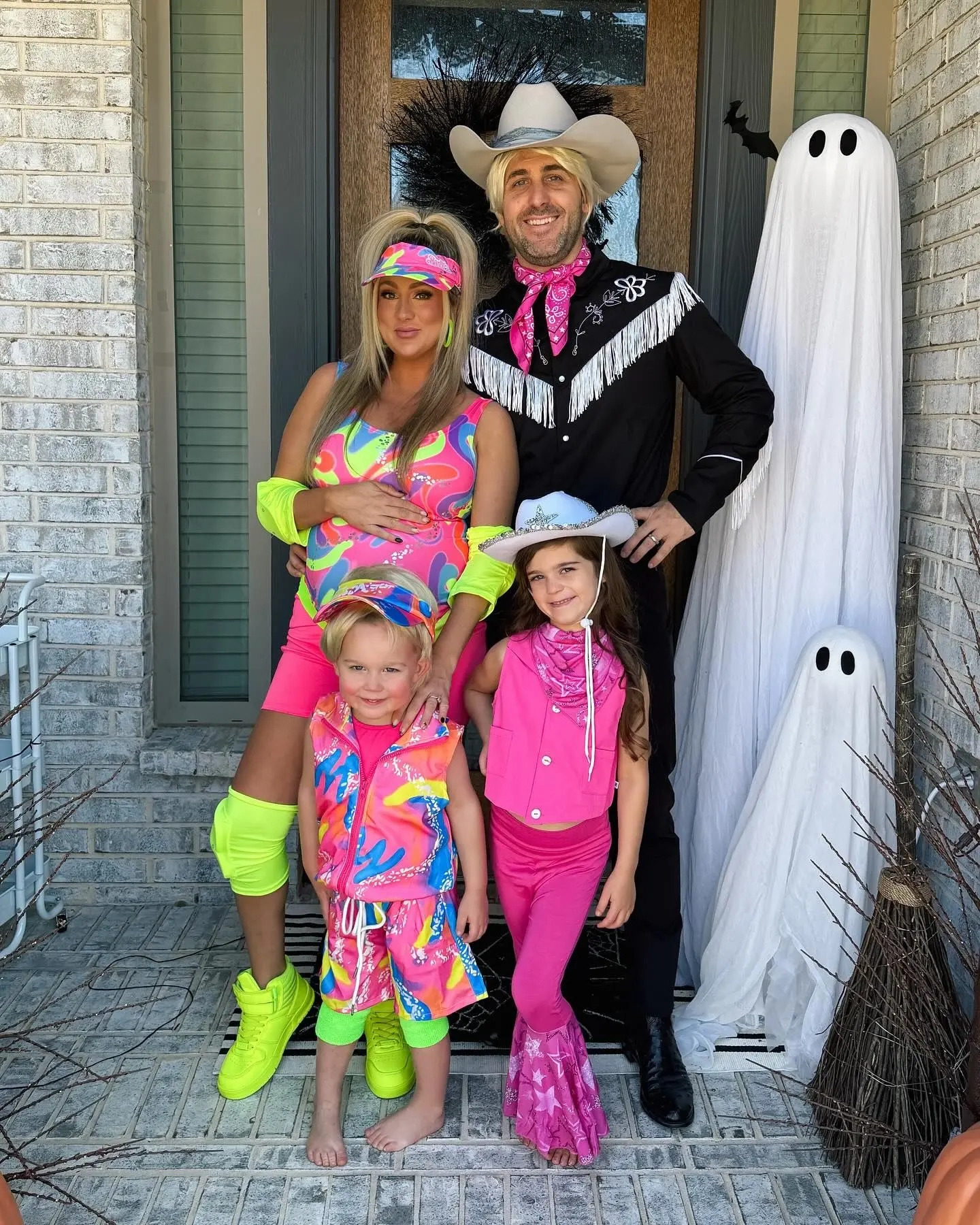 family in sailor moon costumes with colored wigs sailor outfits, man in tuxedo mask costume, women and children in sailor scout costumes sailor moon family outfits 17