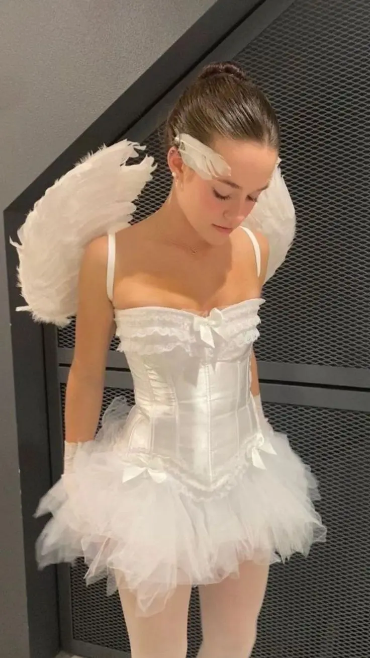 white corset with large white feathered wings white tulle skirt angel halo outfit 9
