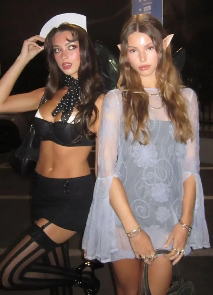 two women angel costumes one white dress silver wings one black outfit dark wings outfit 18