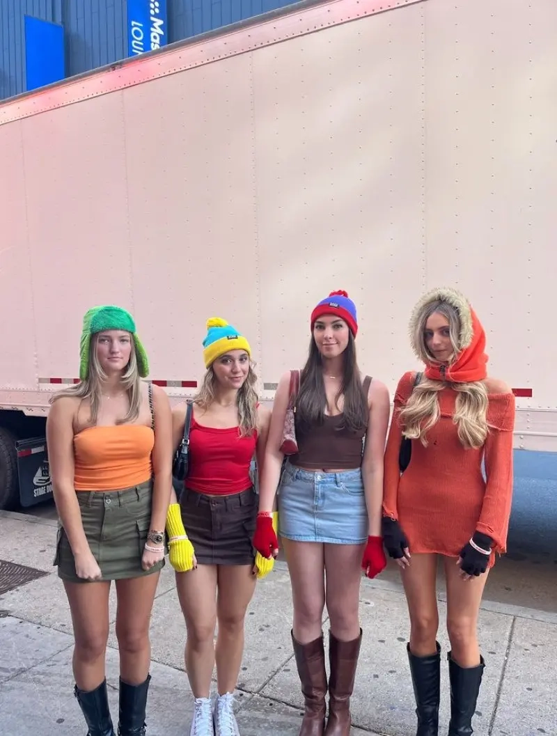 group of women in pink and white bank robber costumes with ski masks money props outfit 18
