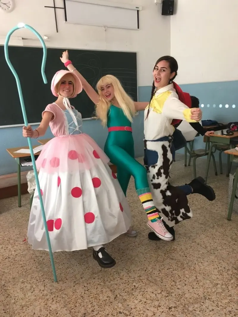three women in toy story costumes including bo peep buzz lightyear and woody in classroom setting outfit 6