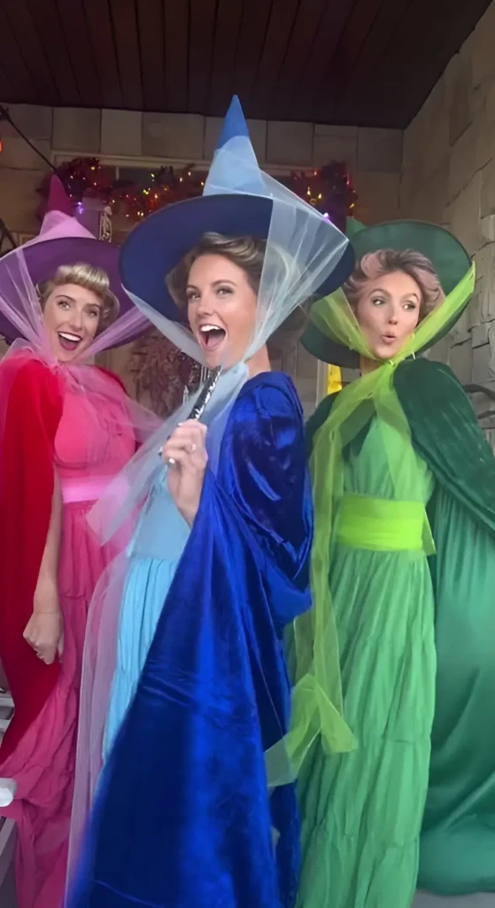 three women in sleeping beauty fairy costumes pink blue green gowns pointed hats 17