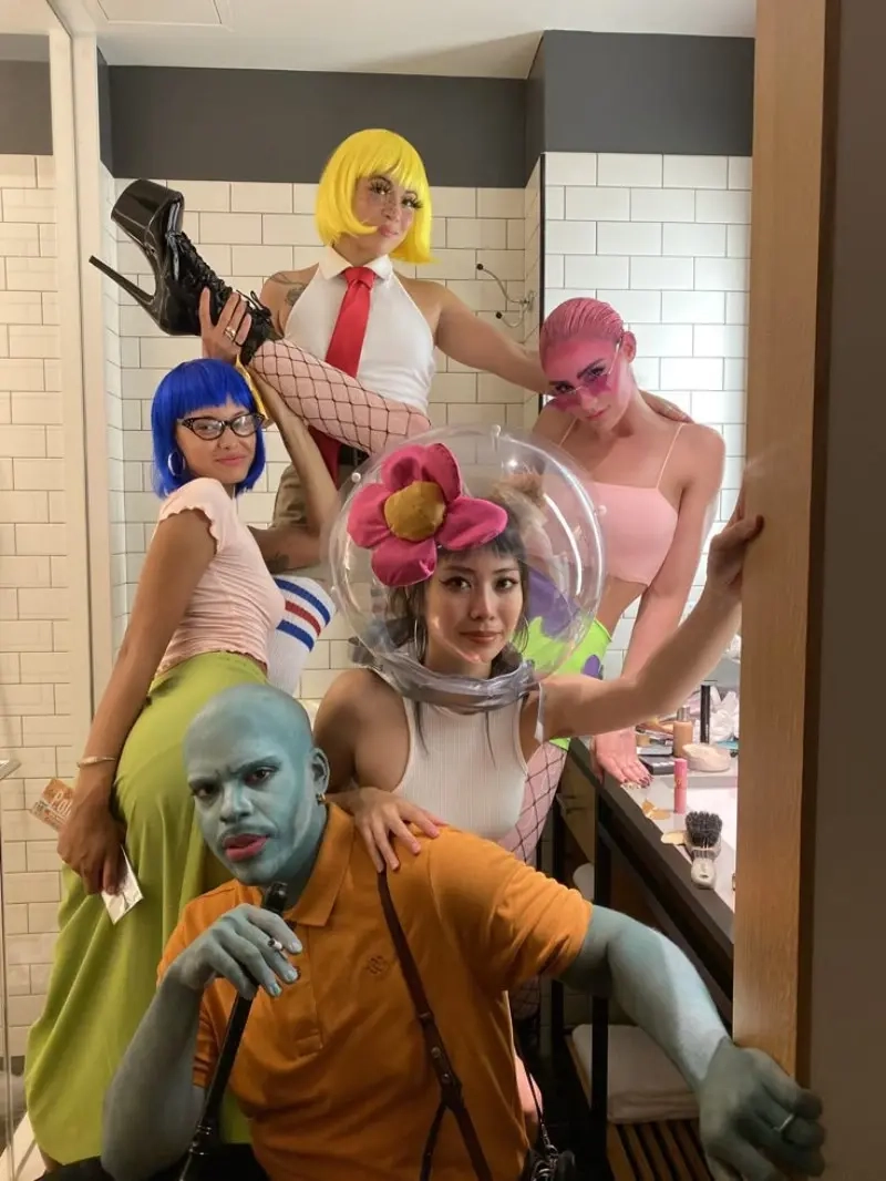 group of women in spongebob character costumes yellow blonde wig squidward theme 18