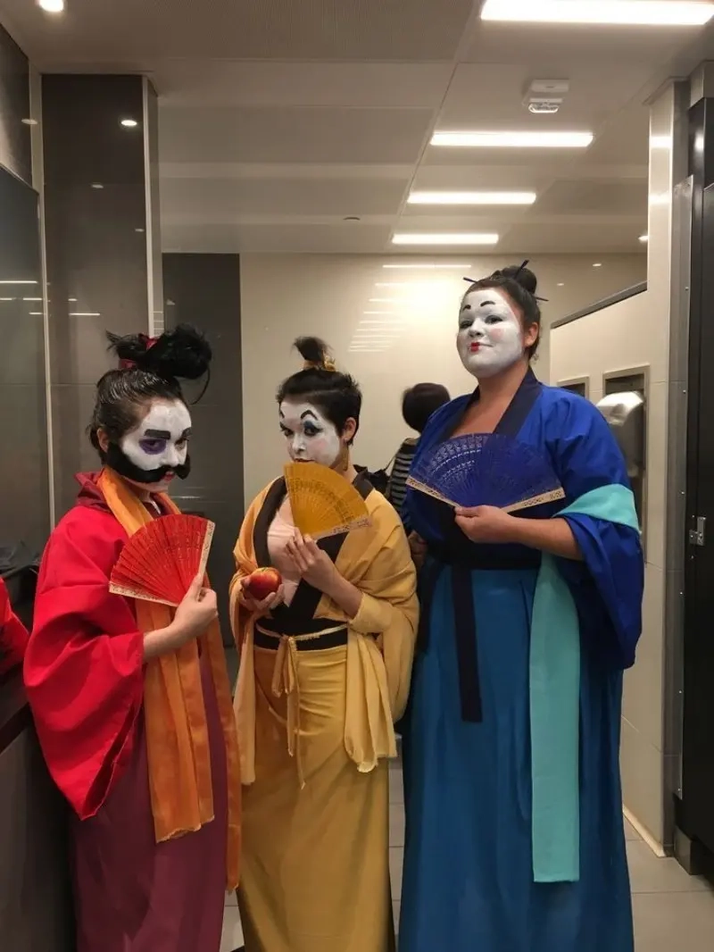three women in geisha costumes flowing robes fans white face paint 13