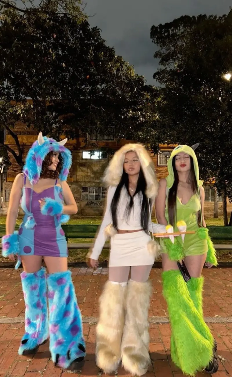 three women in monsters inc costumes blue furry sulley white mike green boo 3