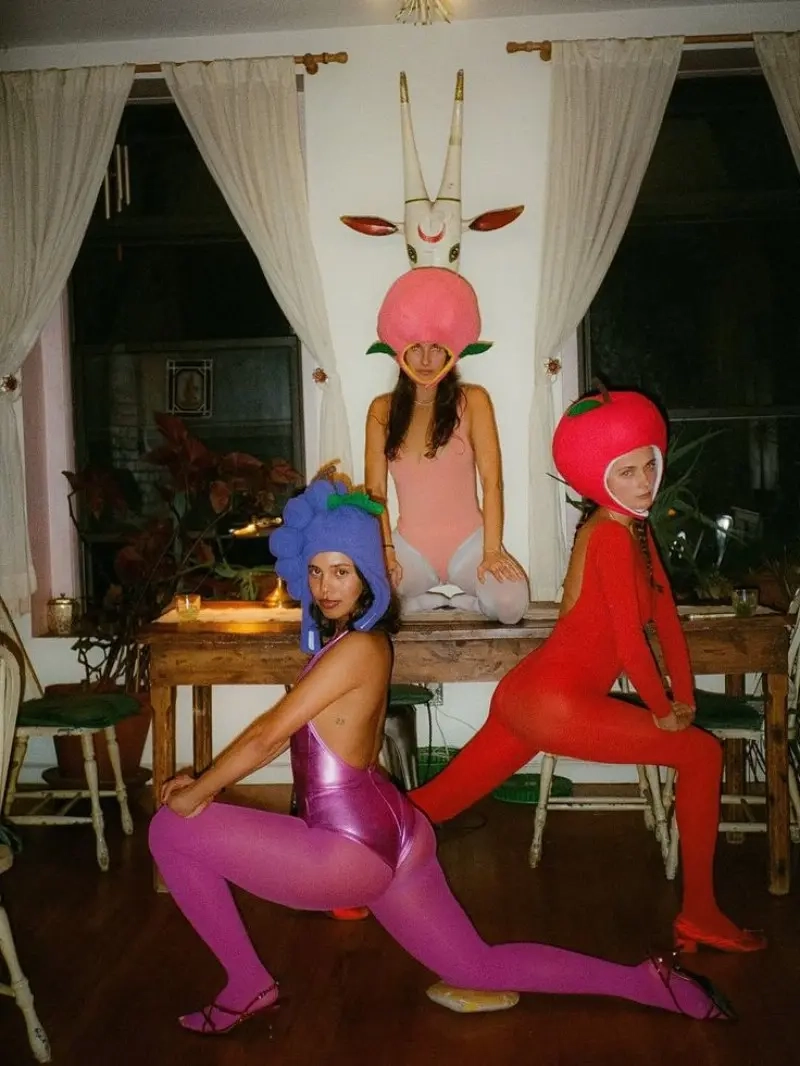 group of women in vegetable costumes produce inspired hats colorful outfits 16