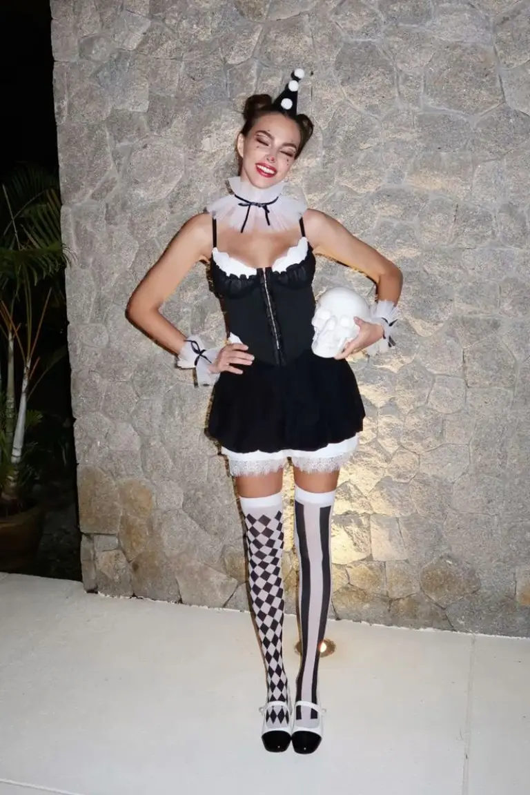 woman in black white french maid costume with checkered stockings and hat circus style 2