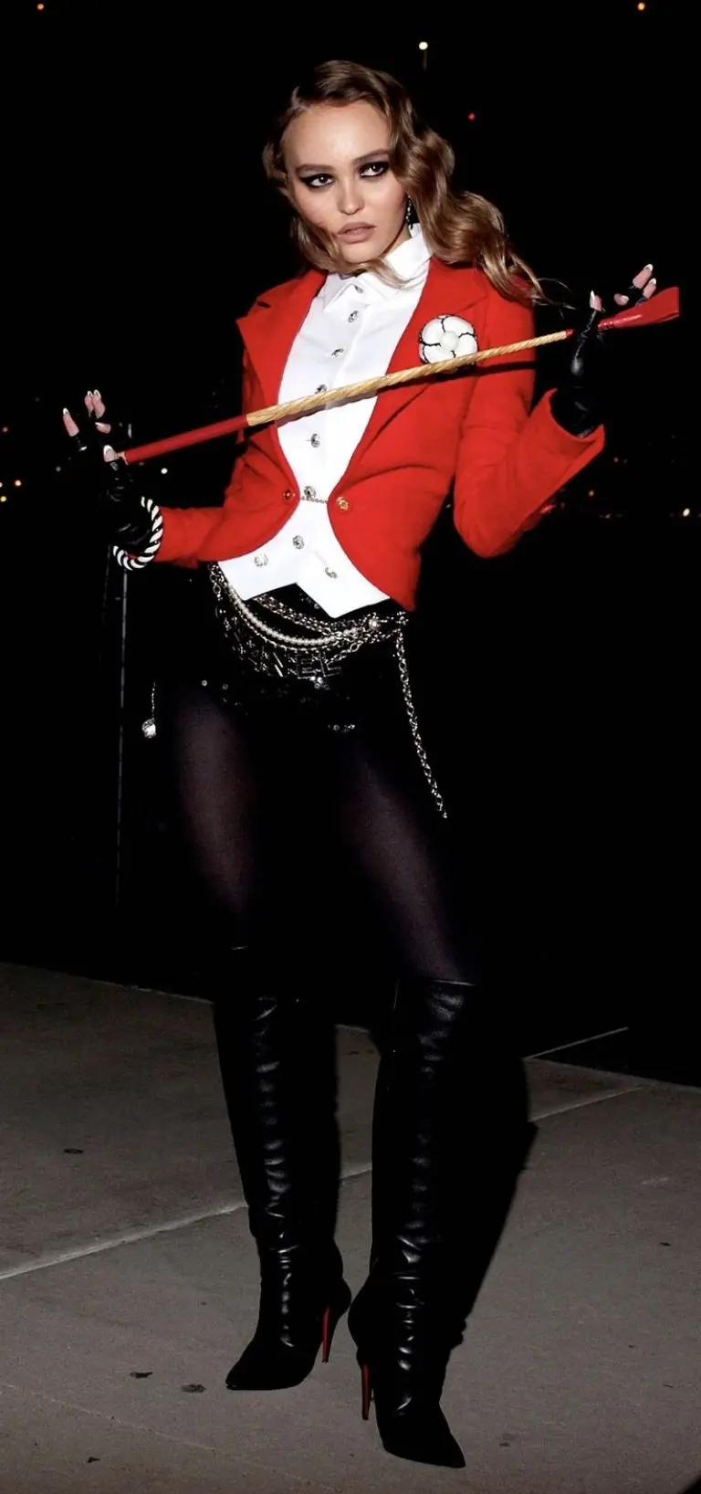 woman in red military jacket white shirt black boots ringmaster costume with whip and hat 7
