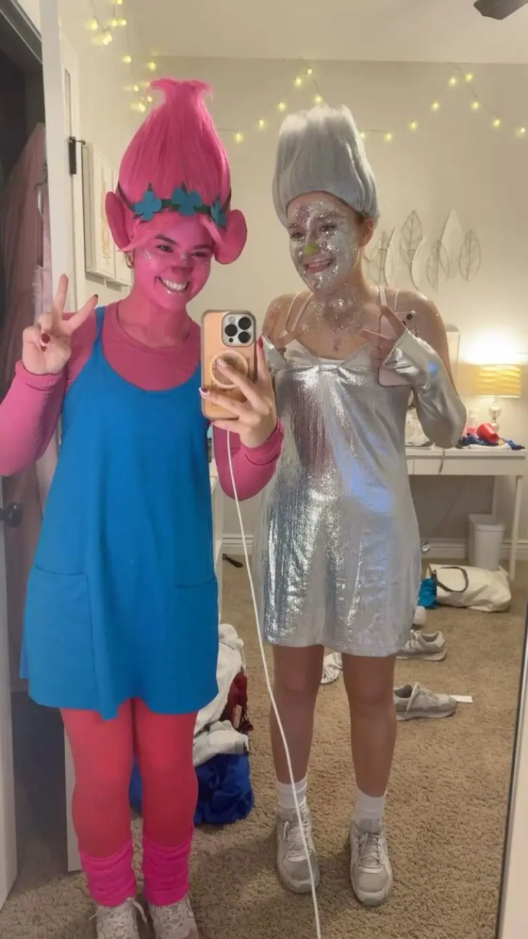 two women as Trolls characters with bright colored wigs and sparkly dresses outfit 5