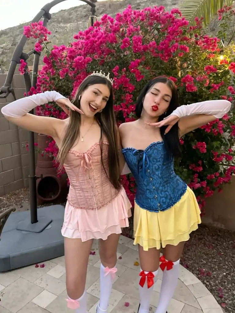 two women in Disney princess costumes with corset tops and flowing skirts outfit 6