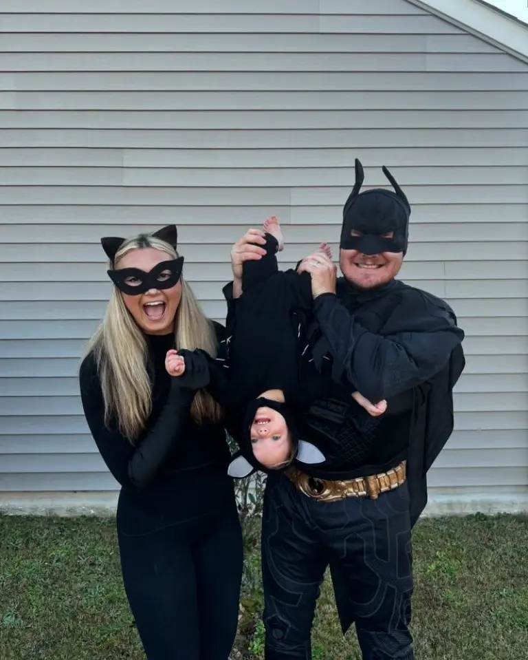 family in batman themed costumes black outfits batman masks capes baby in black batman costume 4