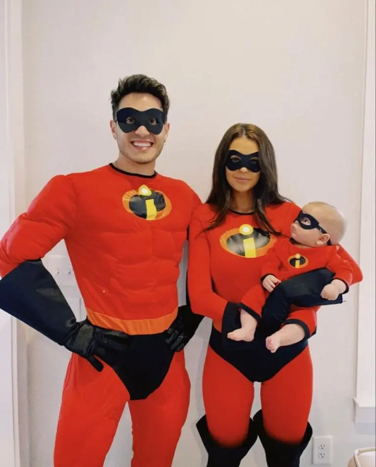 family wearing red incredibles superhero costumes with black masks and logos baby in matching red suit 5