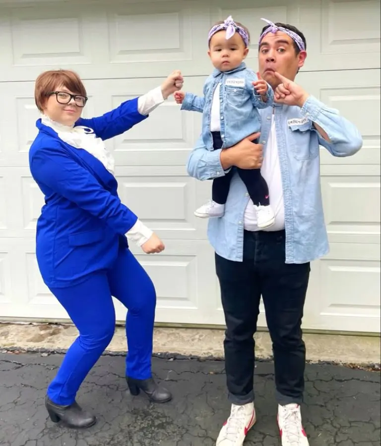 family in austin powers themed costumes blue suits glasses wigs baby in matching spy outfit 8