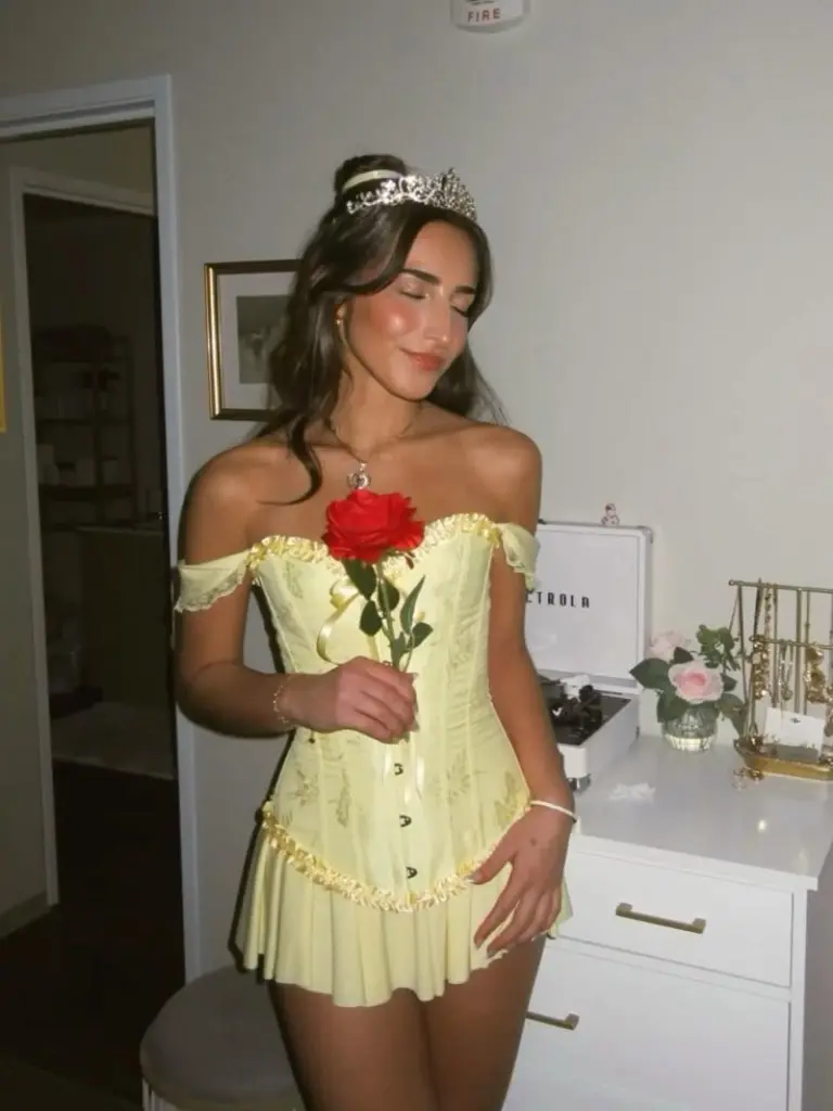 woman in yellow off-shoulder corset with tiara holding red rose outfit 4