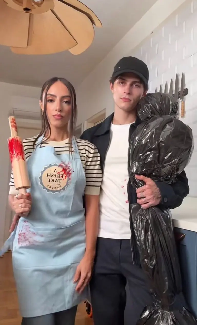woman in blue apron fresh tart baker outfit man covered in black garbage bag outfit 10