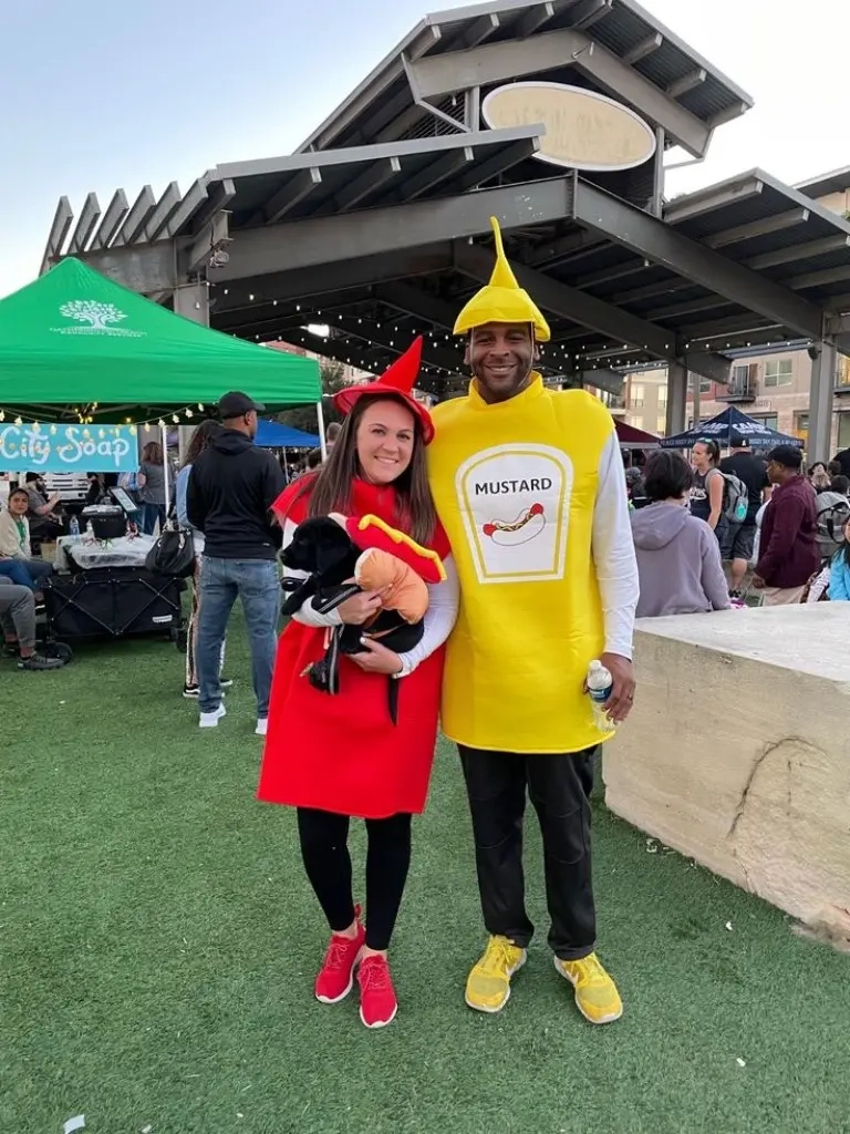 woman in red ketchup costume man in yellow mustard costume outdoor event outfit 8