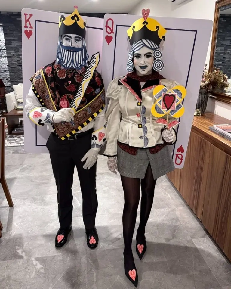 man woman in elaborate king queen of hearts playing card costumes with crowns makeup outfit 7