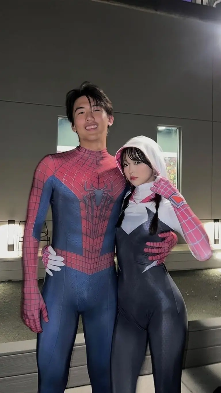 man in red blue spider-man suit woman in black white spider-gwen costume with hood outfit 12