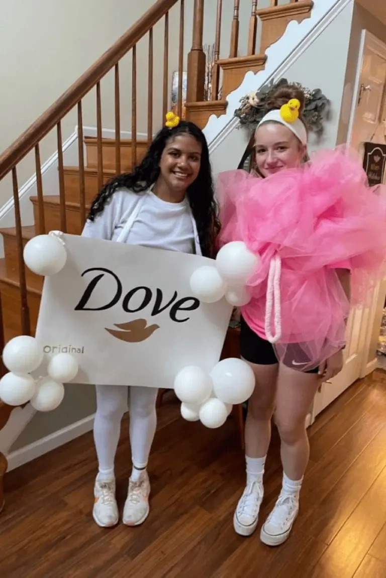two teenage girls wearing dove soap and pink loofah bathroom products costumes white and pink outfit 6