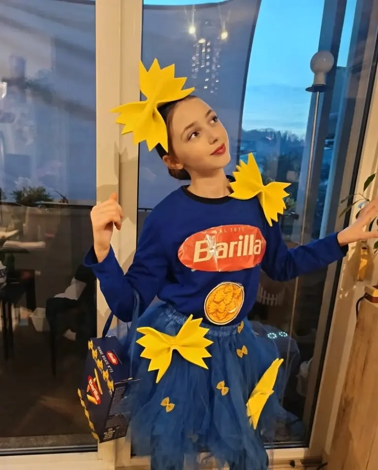 teenage girl wearing blue barilla pasta box costume with yellow pasta decorations outfit 5
