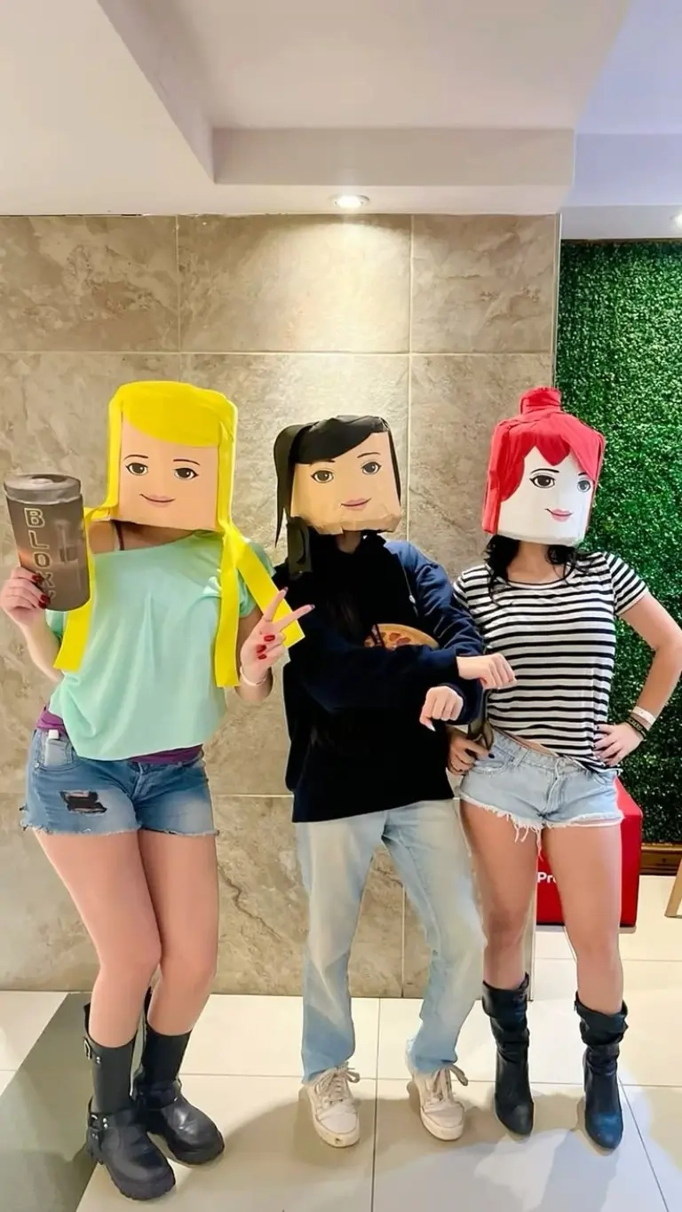 three teenage girls wearing roblox avatar costumes with blocky character heads casual outfits gaming theme outfit 14