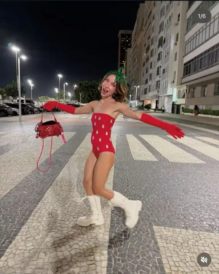 woman wearing red bodysuit with white spots and green leaf hat strawberry costume outfit 15