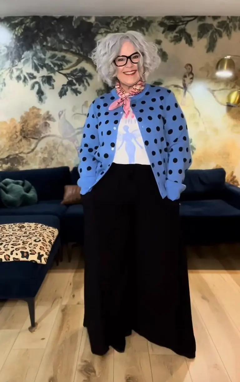 woman in blue polka dot cardigan white top black maxi dress silk scarf glasses 2