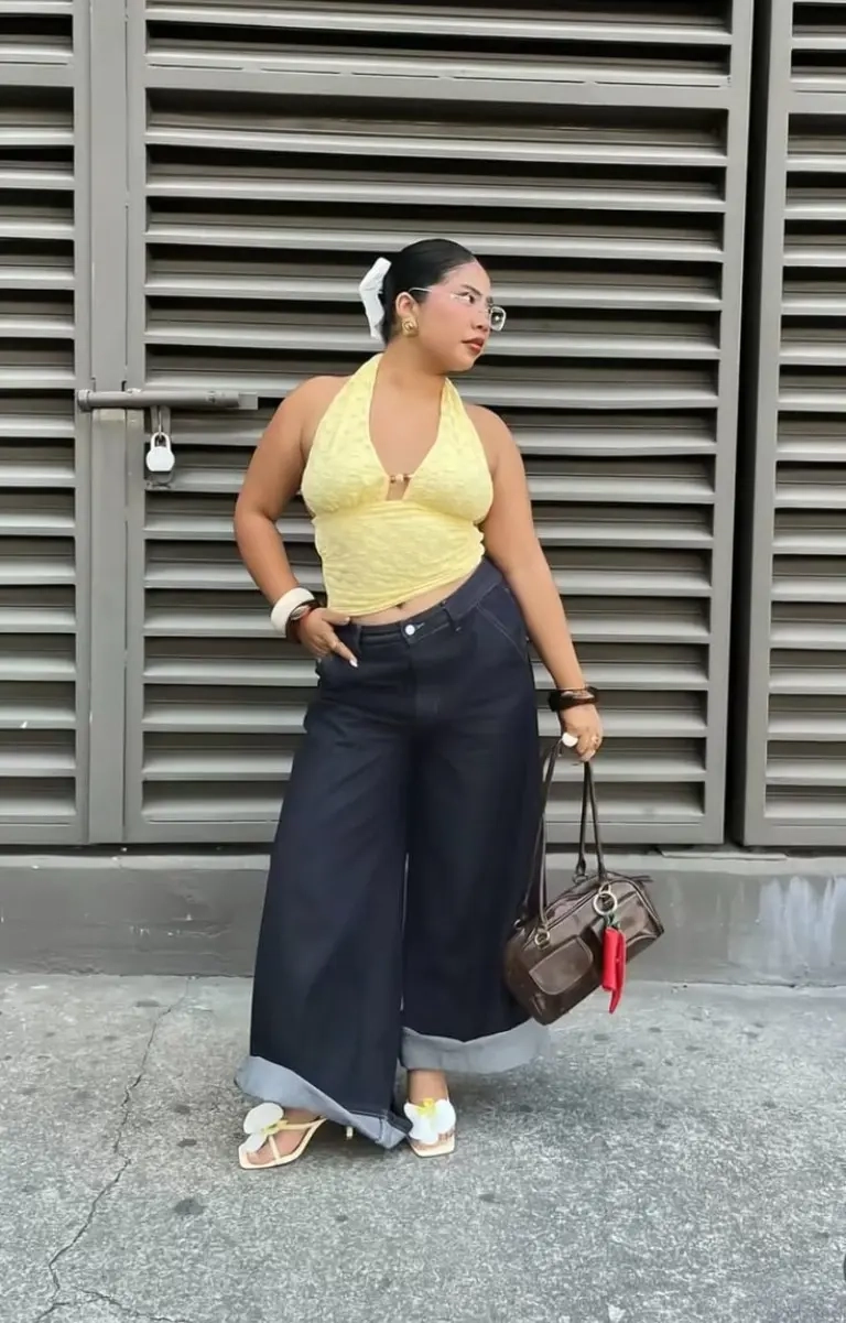 yellow halter top dark wide leg jeans sandals brown bag outfit 1