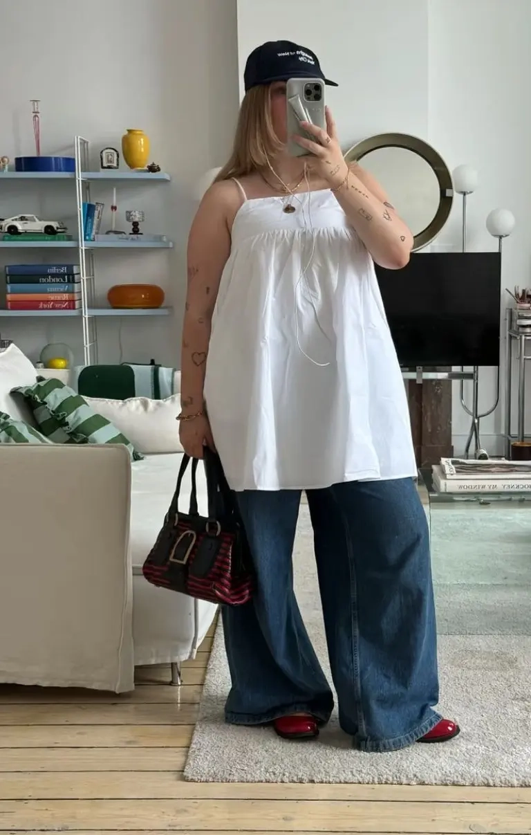 white strapless top baseball cap wide leg jeans bag outfit 5