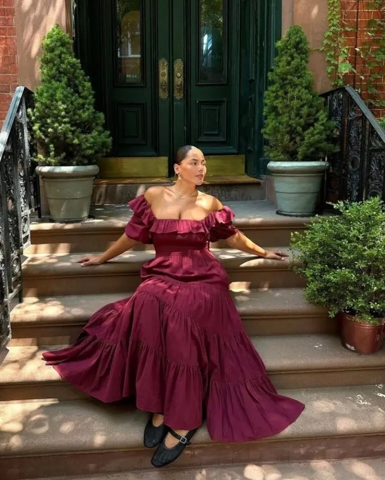 woman in burgundy off shoulder tiered ruffle maxi dress black flats stairs outfit 12