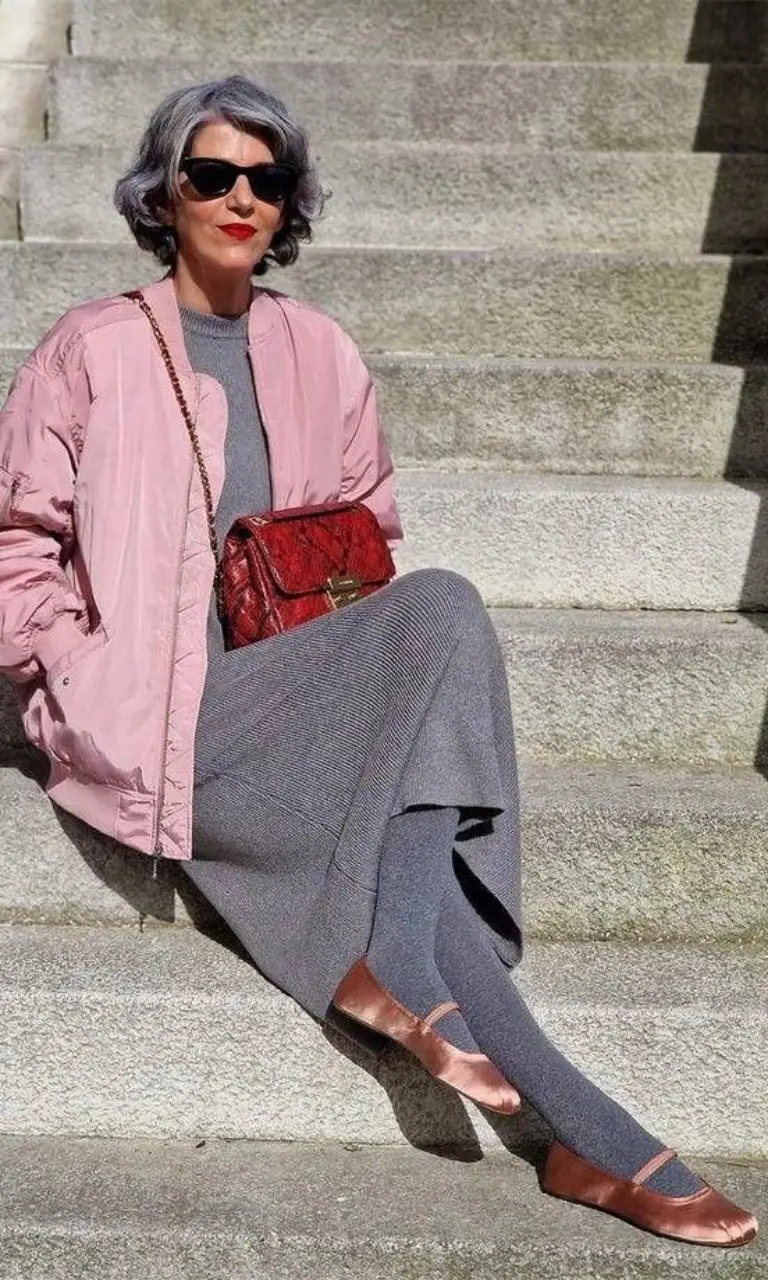 pink bomber jacket gray knit top gray wide-leg pants red crossbody bag brown leather shoes sunglasses outfit 13