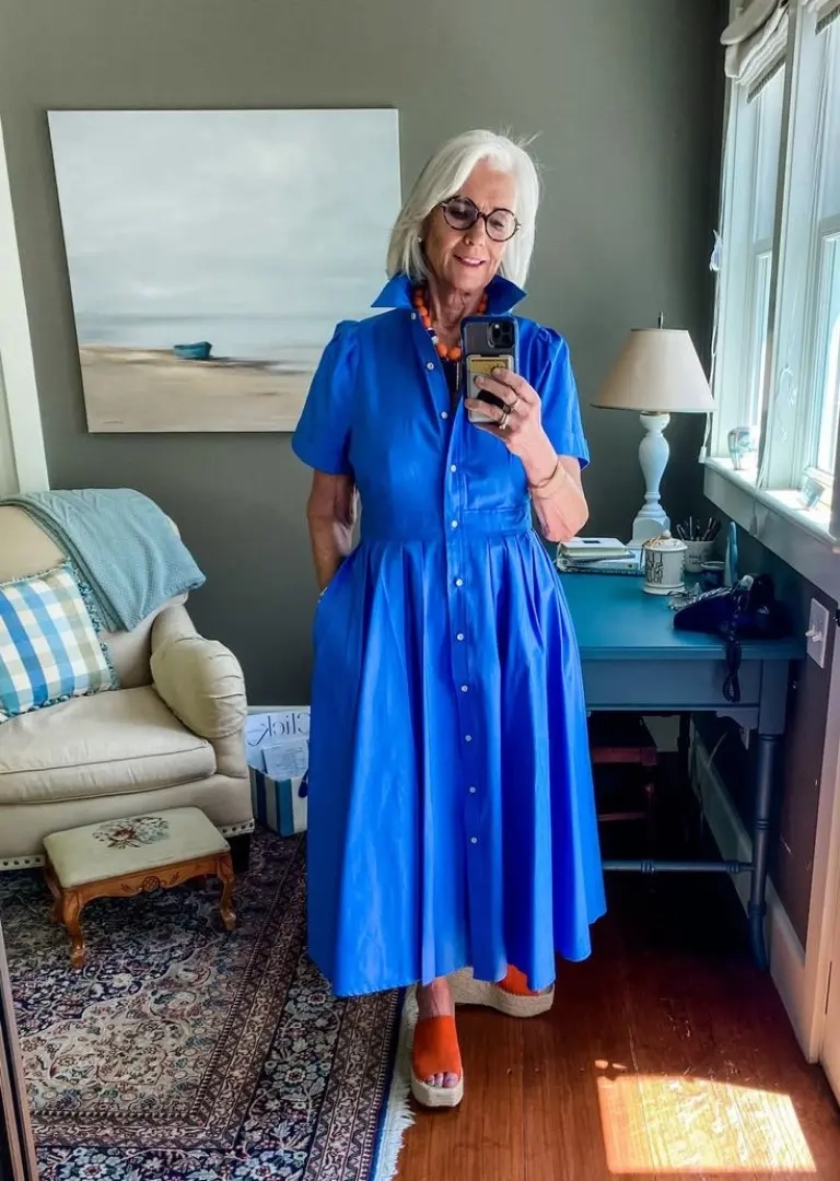 woman in bright blue shirt dress with orange wedge sandals and orange beaded necklace outfit 6