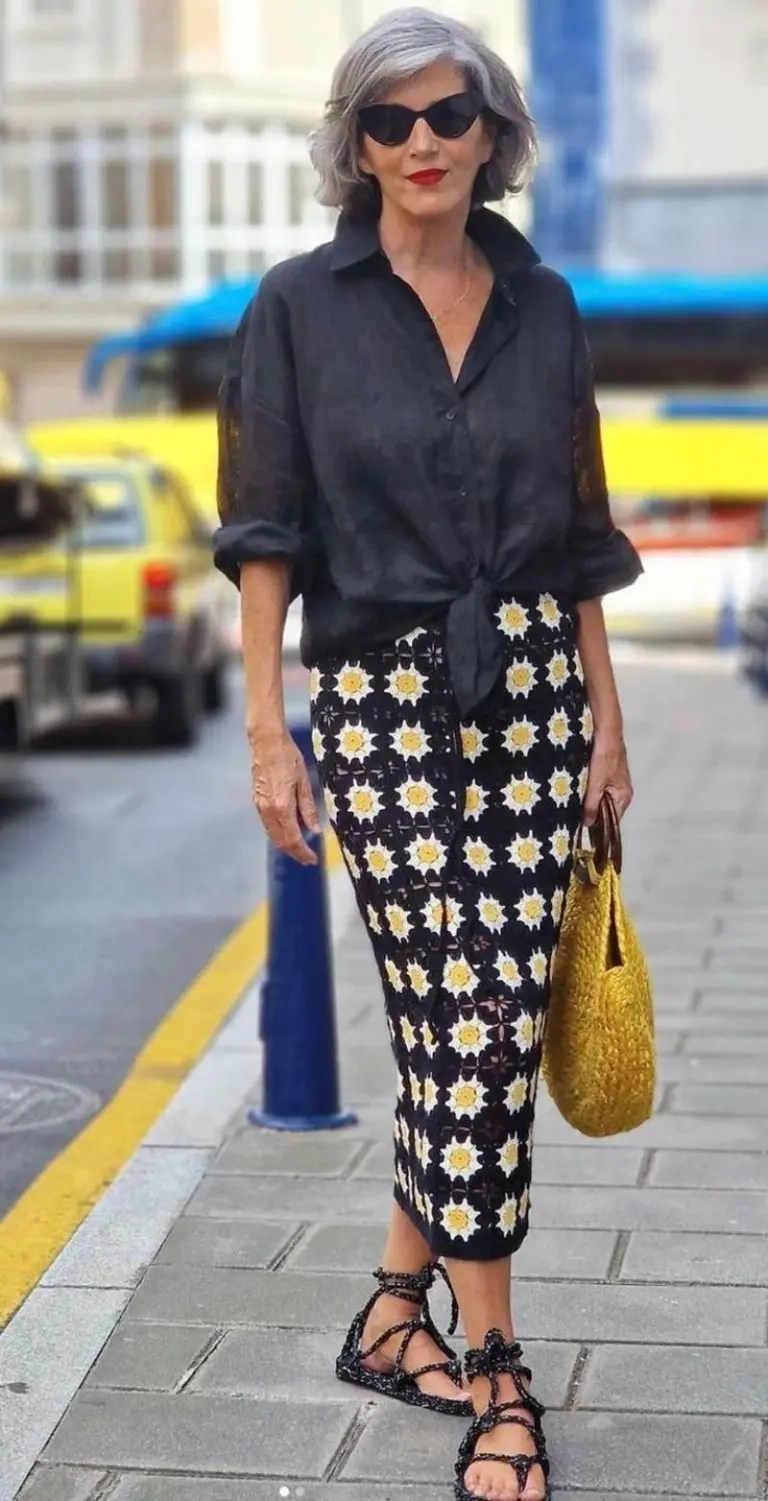 woman wearing black button-down over floral pencil skirt with strappy black sandals and yellow bag outfit 10
