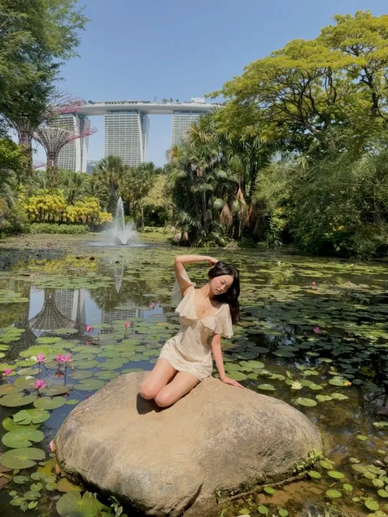 cream off shoulder mini dress white sneakers lotus pond background outfit 9