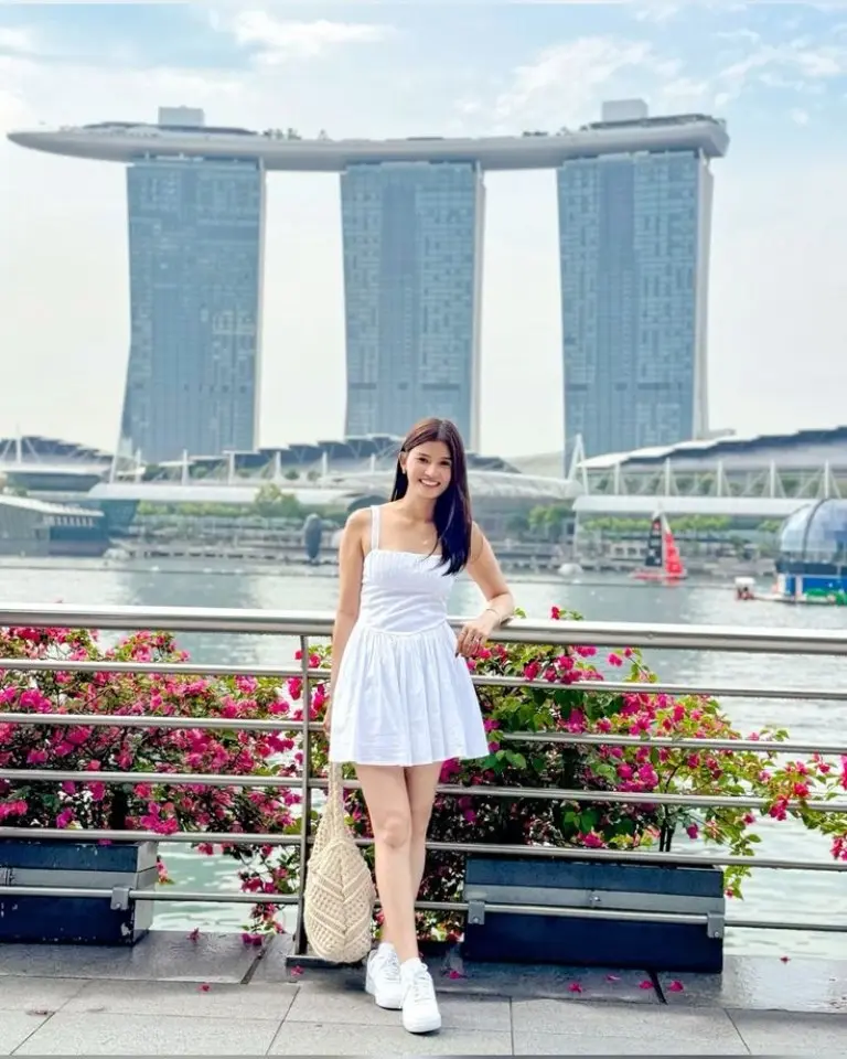 white sundress with belt white sneakers straw bag waterfront outfit 17