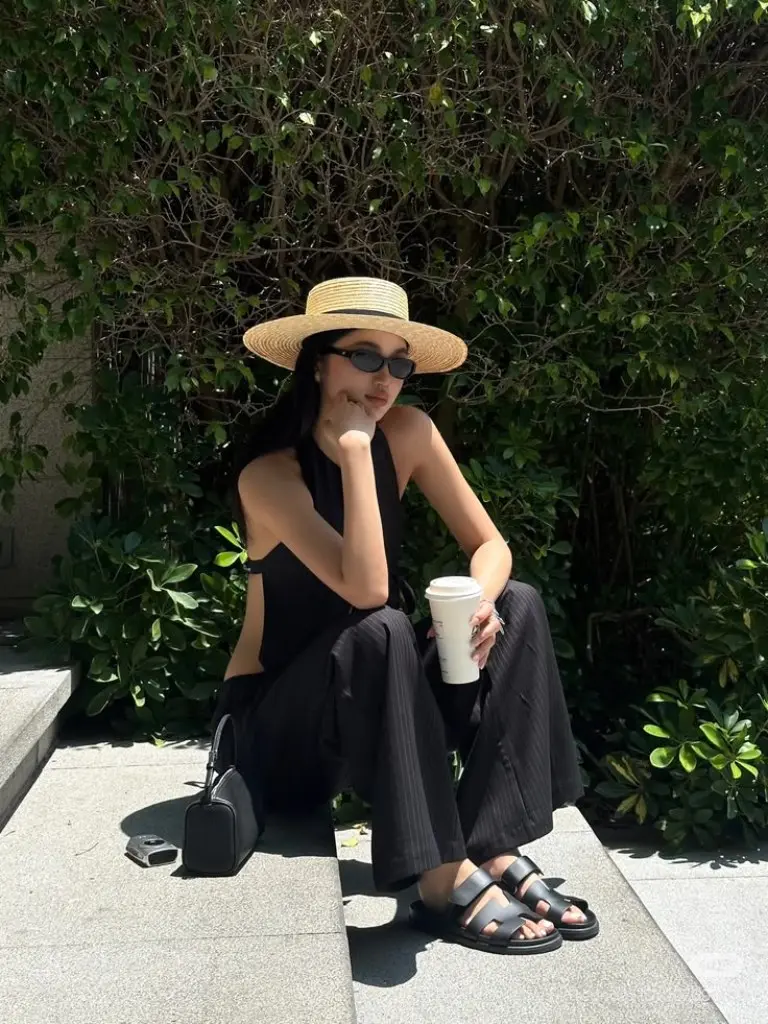 black tank top striped wide leg trousers straw hat birkenstock sandals crossbody bag coffee outfit 1