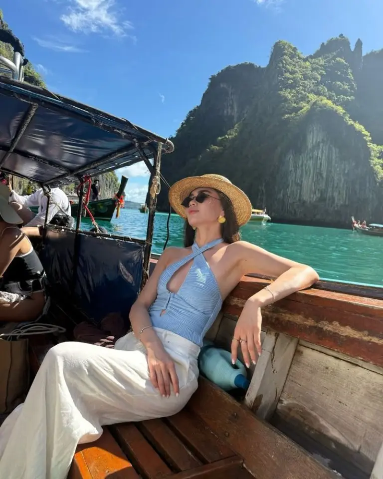 blue ribbed halter top white wide leg pants straw hat sunglasses boat island outfit 2