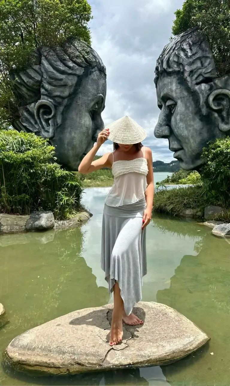 white strapless bandeau gray maxi skirt conical hat limestone karsts boat scenic tour outfit 13