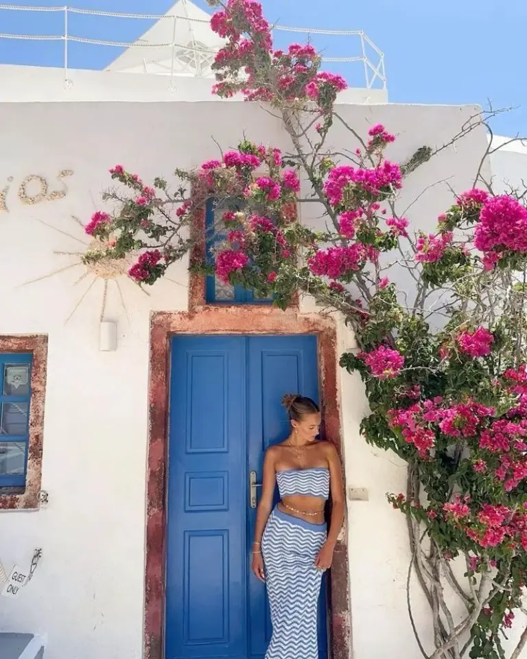 blue and white chevron bandeau top and skirt set against blue door and pink flowers outfit 6