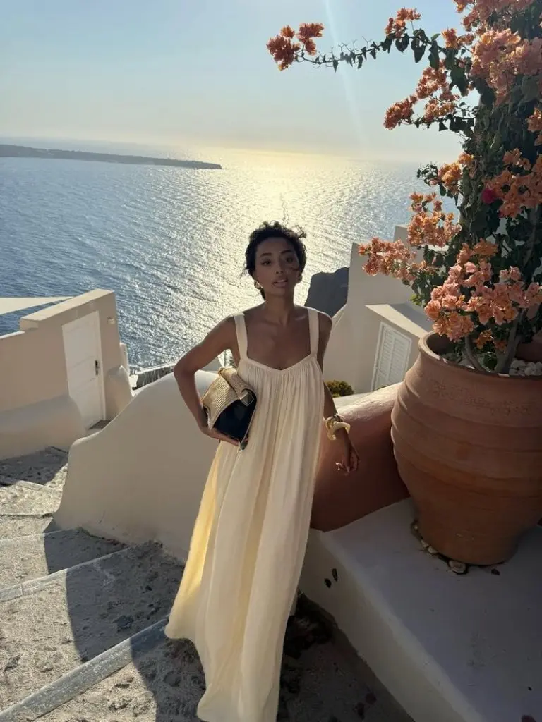cream empire waist maxi dress with straw hat at sunset terrace outfit 8