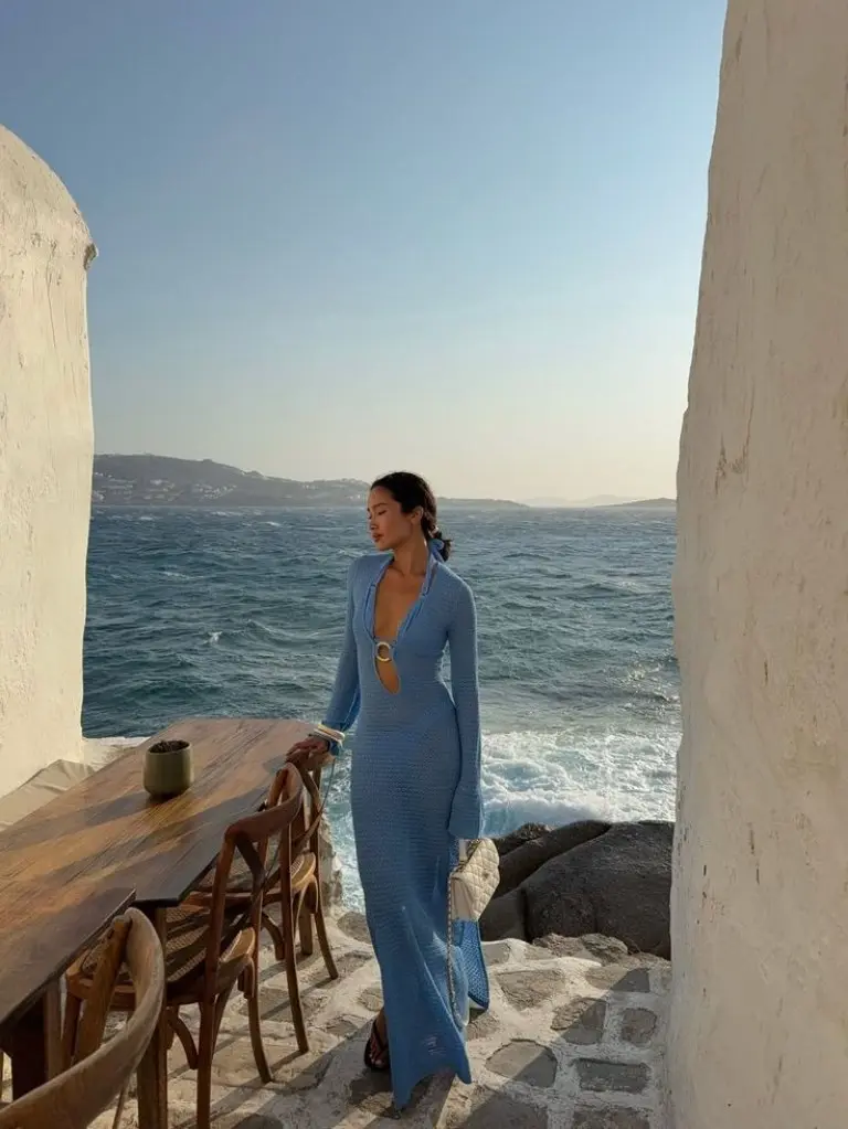 blue textured long sleeve dress with cut-out detail overlooking sea outfit 9