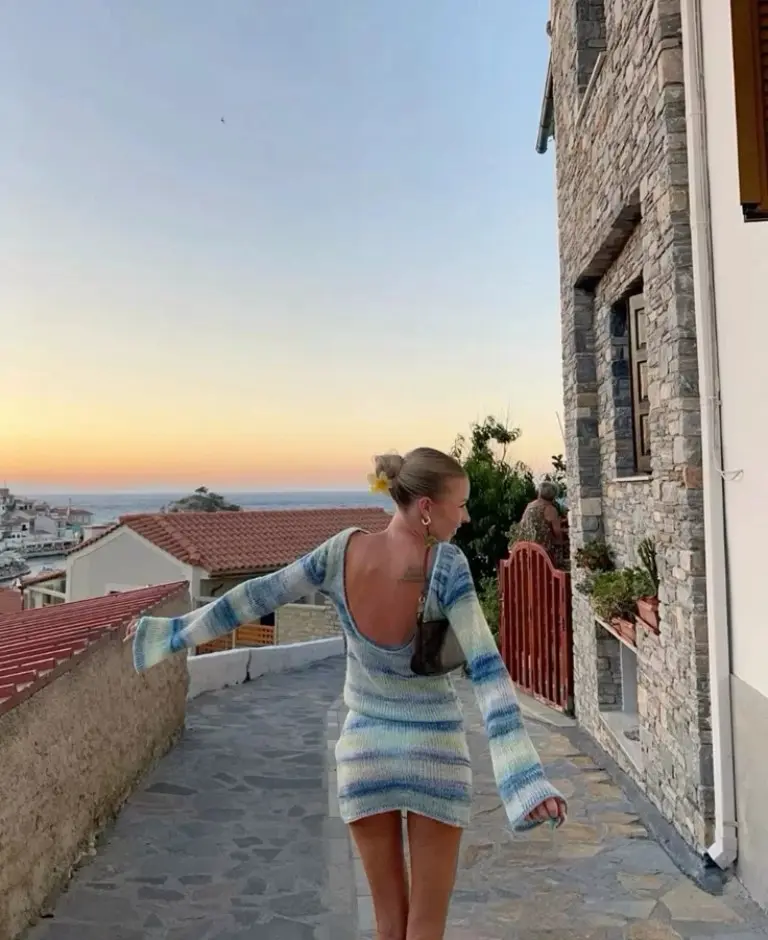 striped knit sweater dress with low back overlooking hillside village outfit 10